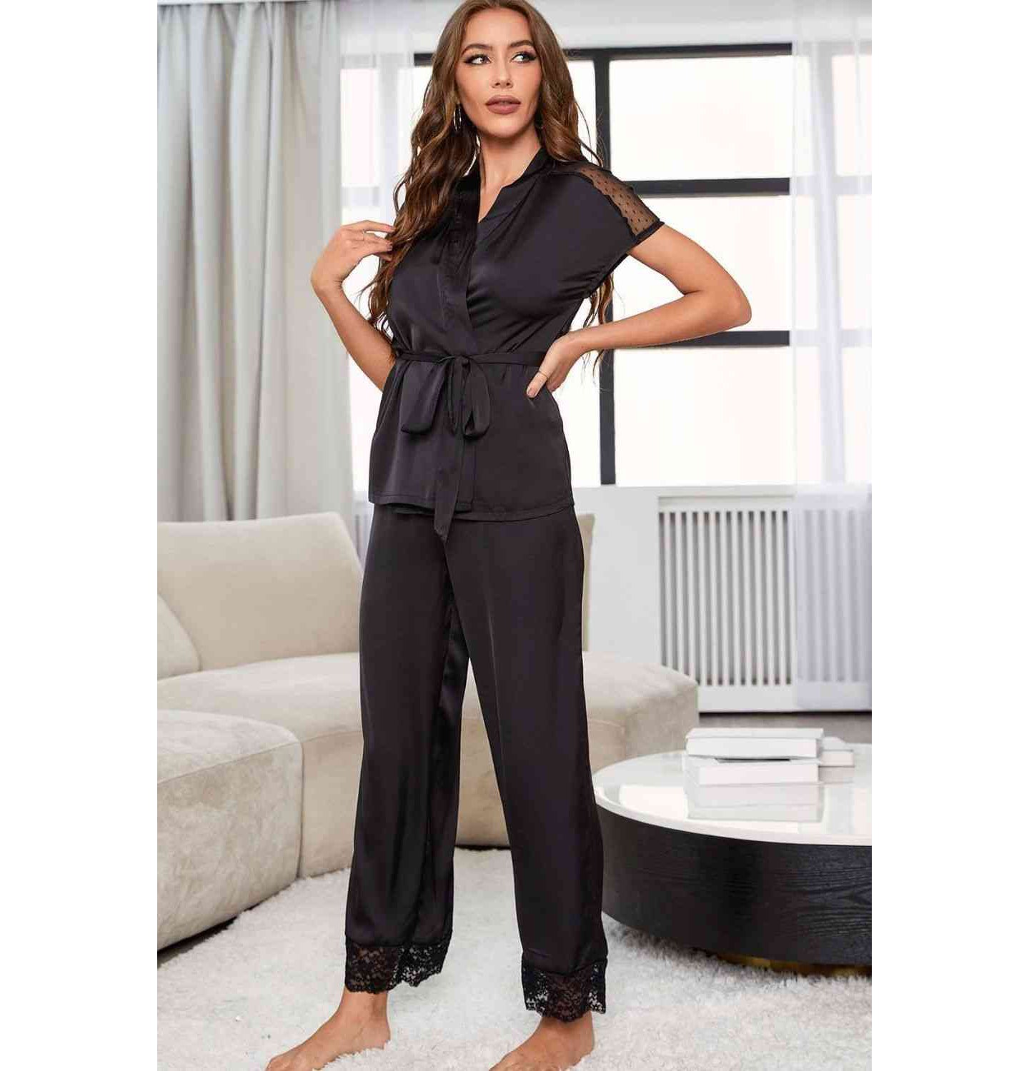 Model wearing short sleeve black lace pajama set