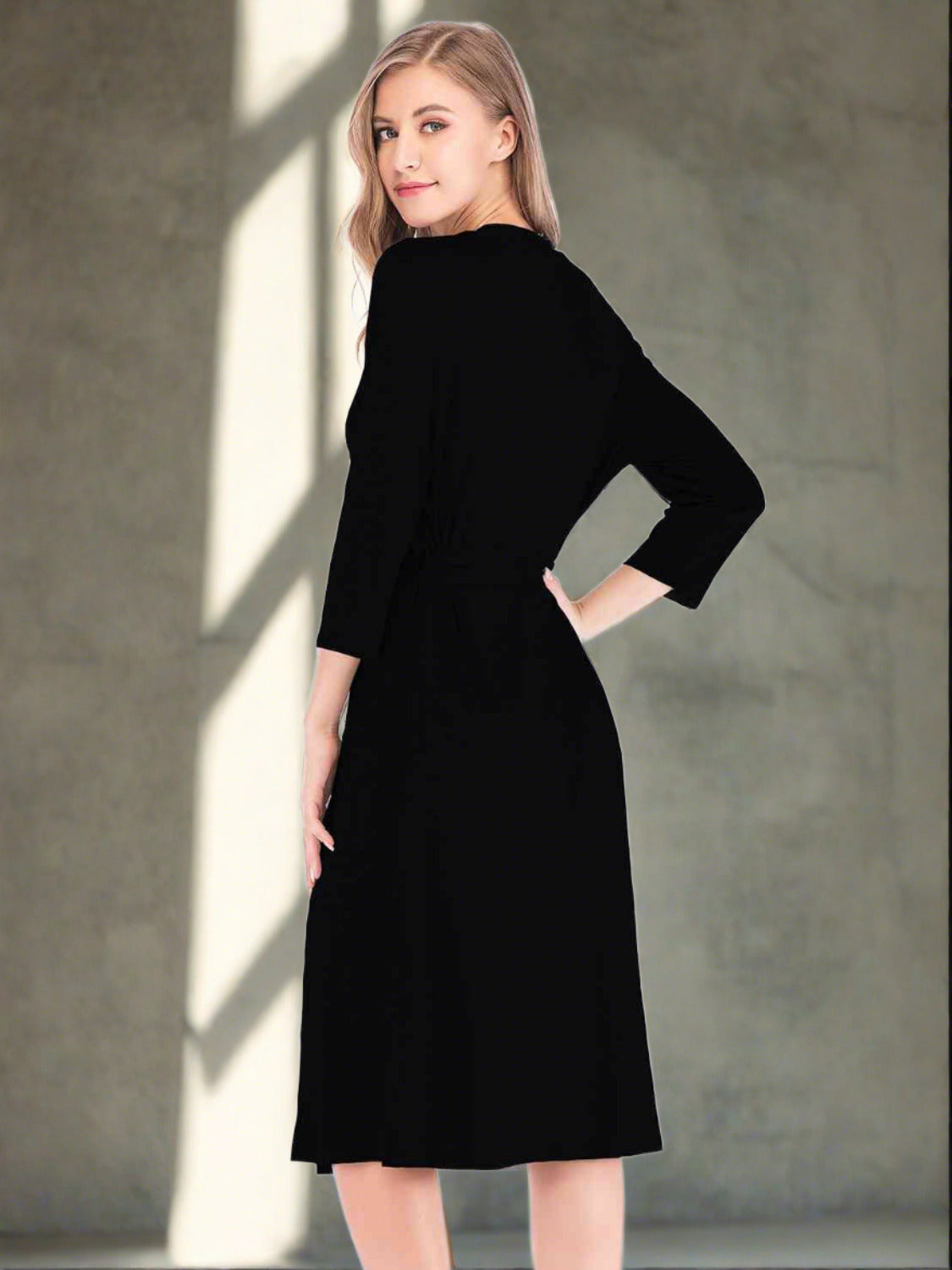 Back of Model wearing black lounge dress