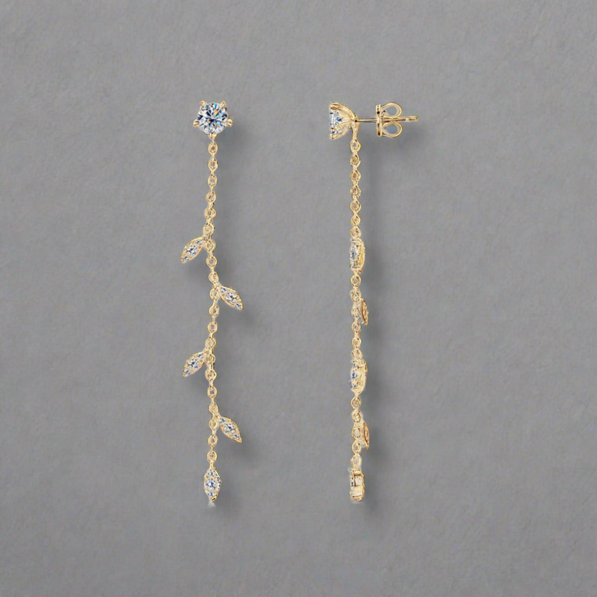 Moissanite drop earrings set in gold plated sterling leaf setting