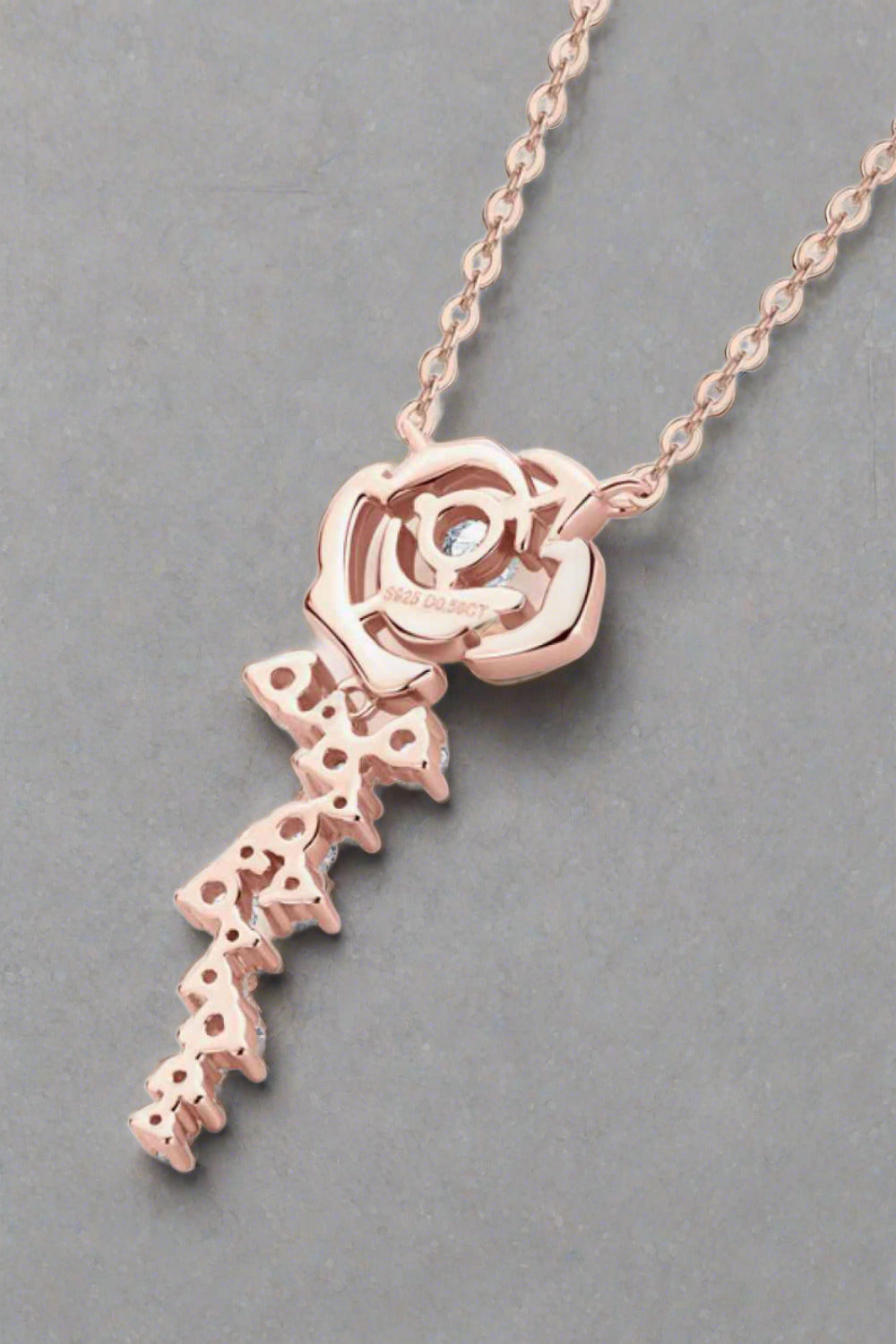 back of moissanite flower pendant set in 18k rose gold sterling silver