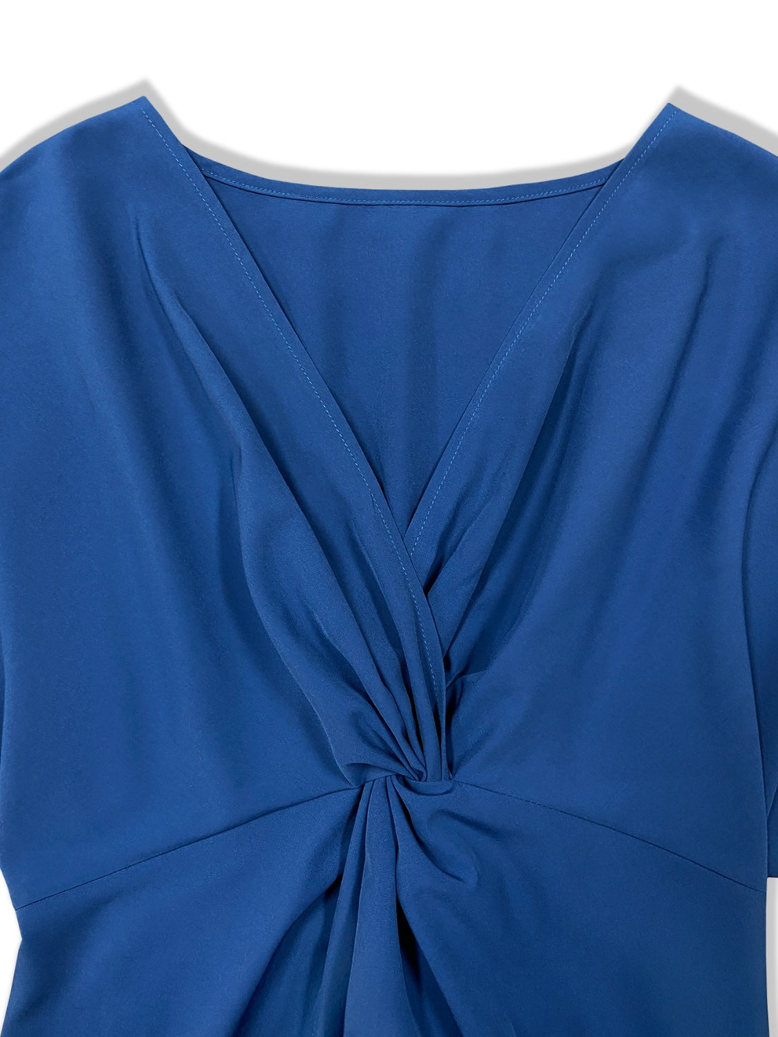 Close up view of top of high low blouse