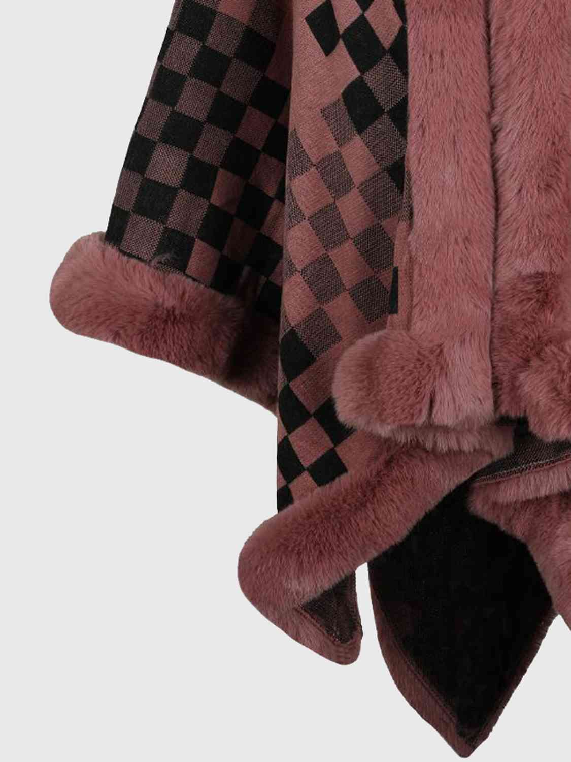 close up of checkered poncho with faux fur trim