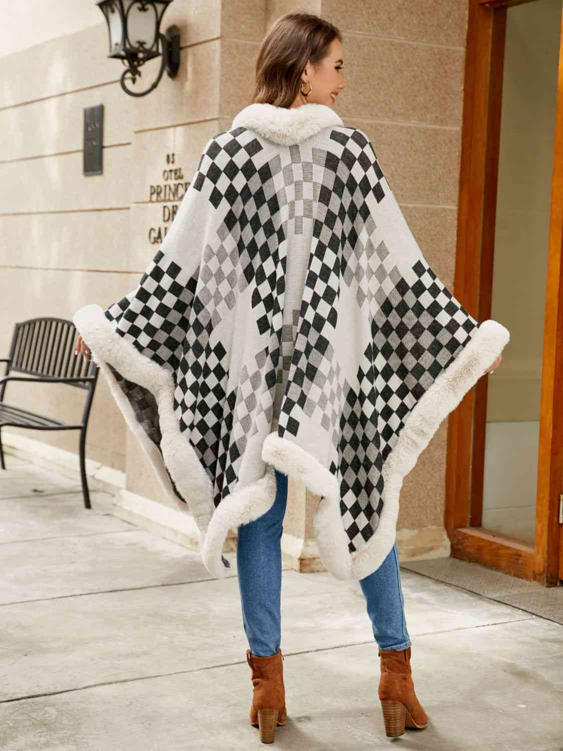 back of Model wearing checkered poncho with faux fur trim