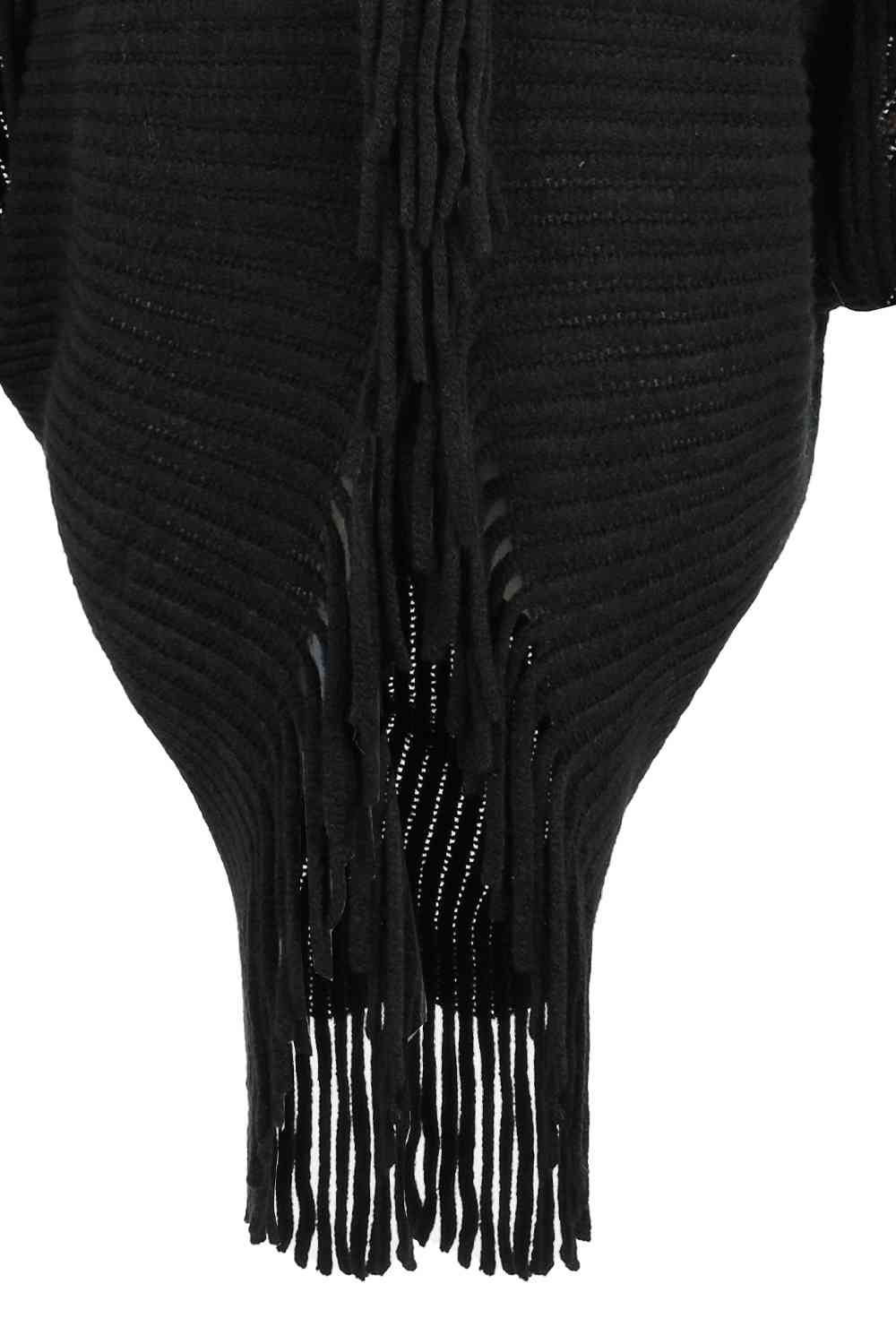 Close up of black open front poncho fringe