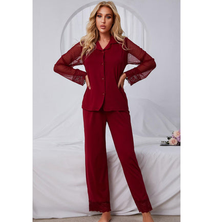Model standing wearing red pajama set with lace arms