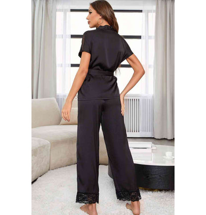 Back view of model wearing short sleeve black lace pajama set