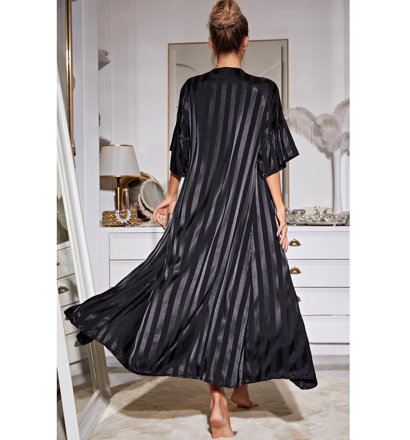 Back of model wearing black stripe nightgown and robe set