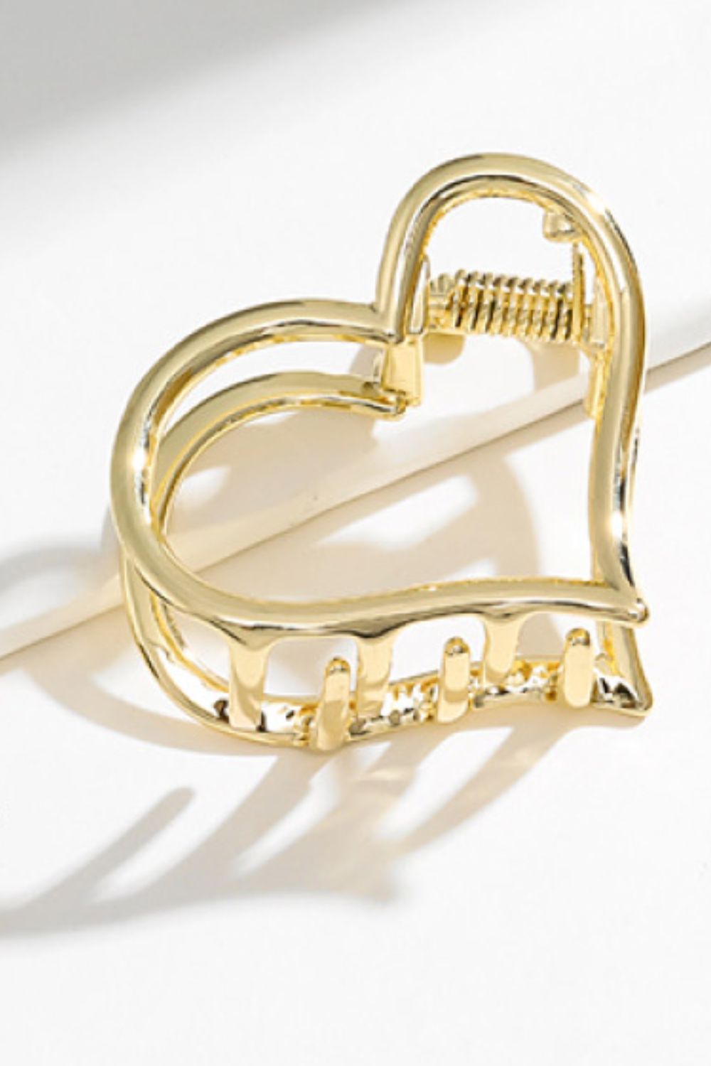 Another angle view of gold plated heart-shape claw clip