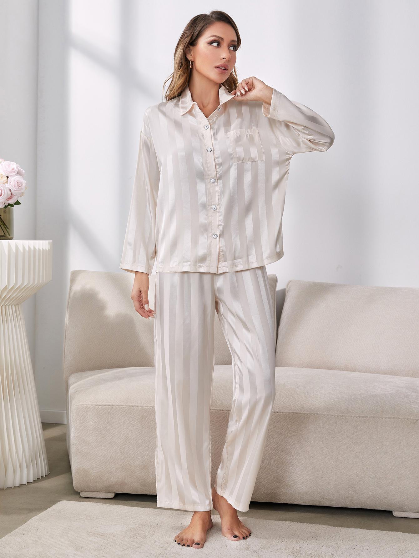 Model standing wearing white striped pajama set