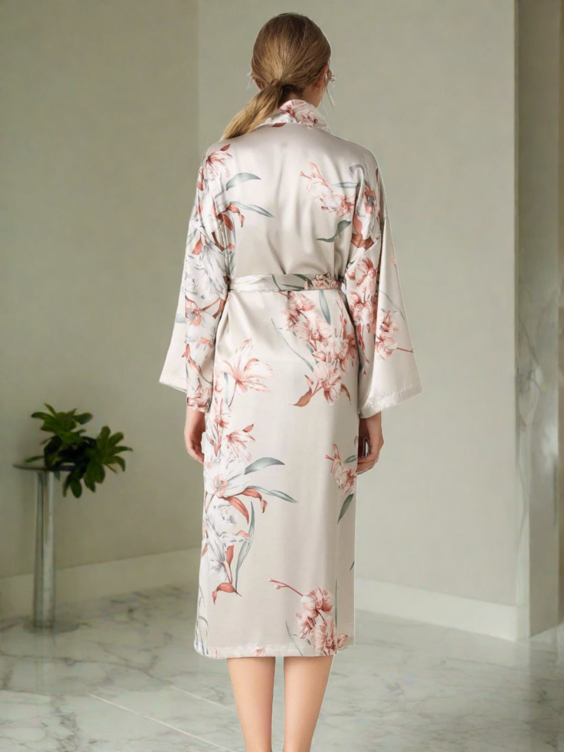 Back of model wearing light gray floral patterned robe