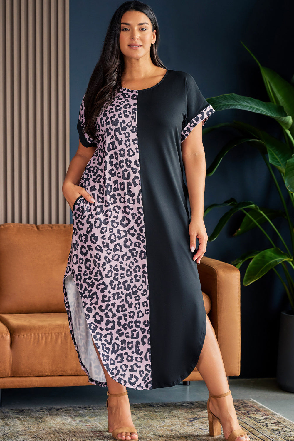 Model wearing plus size short sleeve black and leopard lounge dress