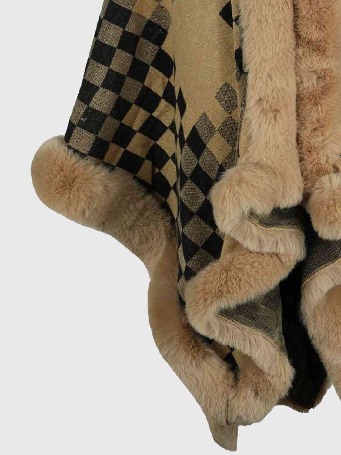 close up of checkered poncho with faux fur trim