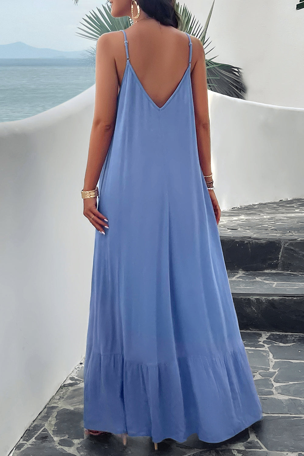 Back of model standing outside wearing blue spaghetti strap loungedress