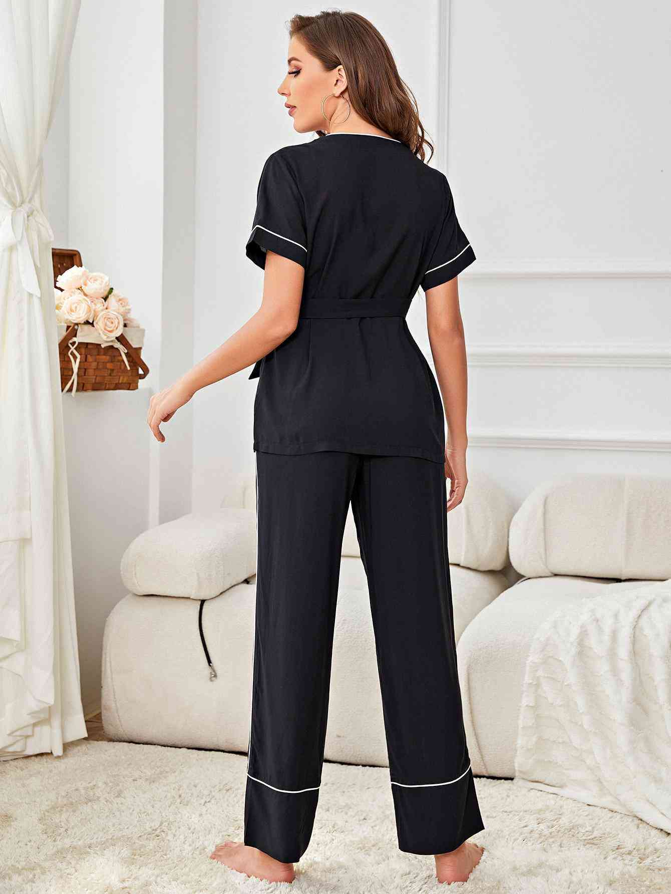 Back of model wearing black short sleeve pajama set