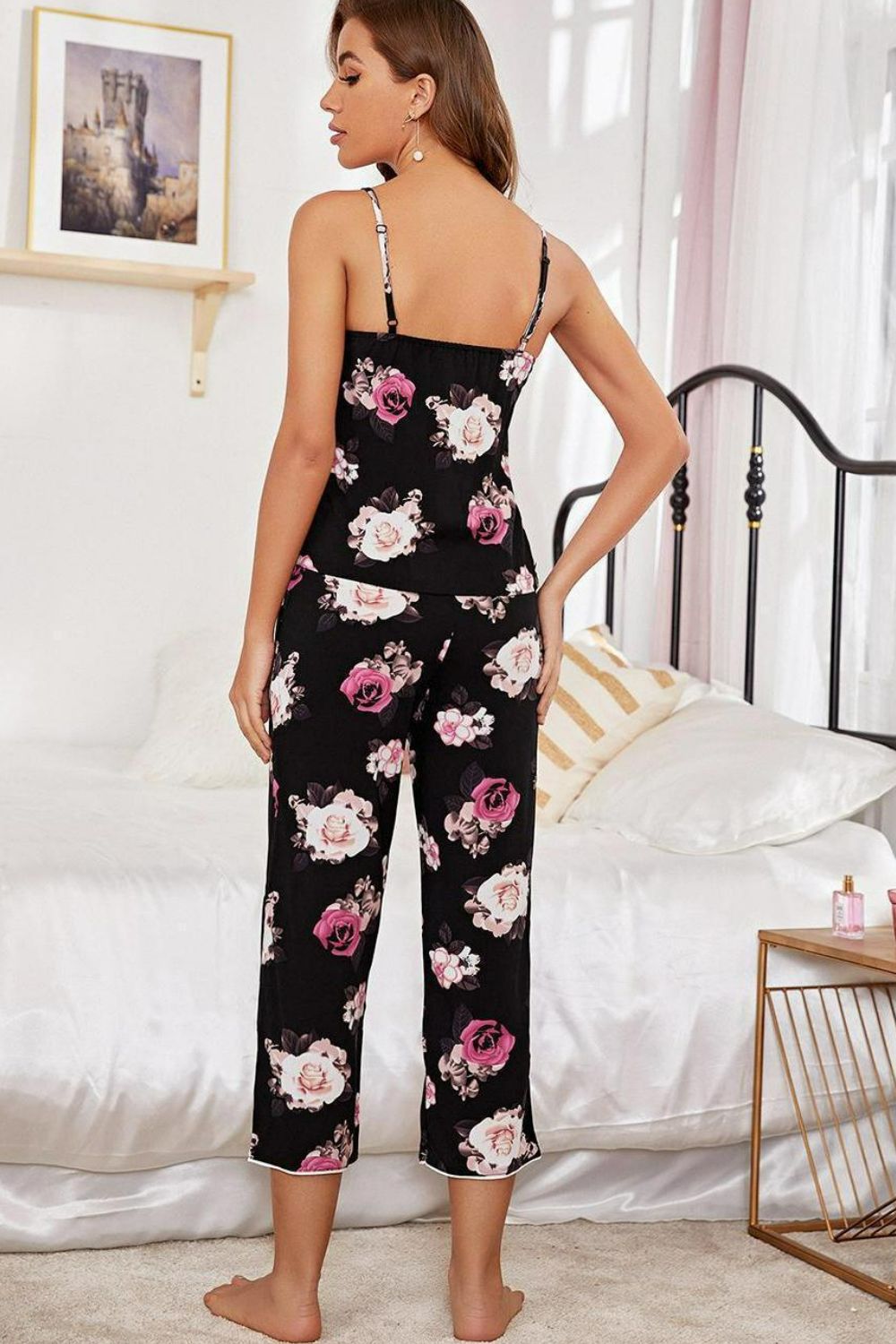 Model wearing floral print cami and capri pants lounge set