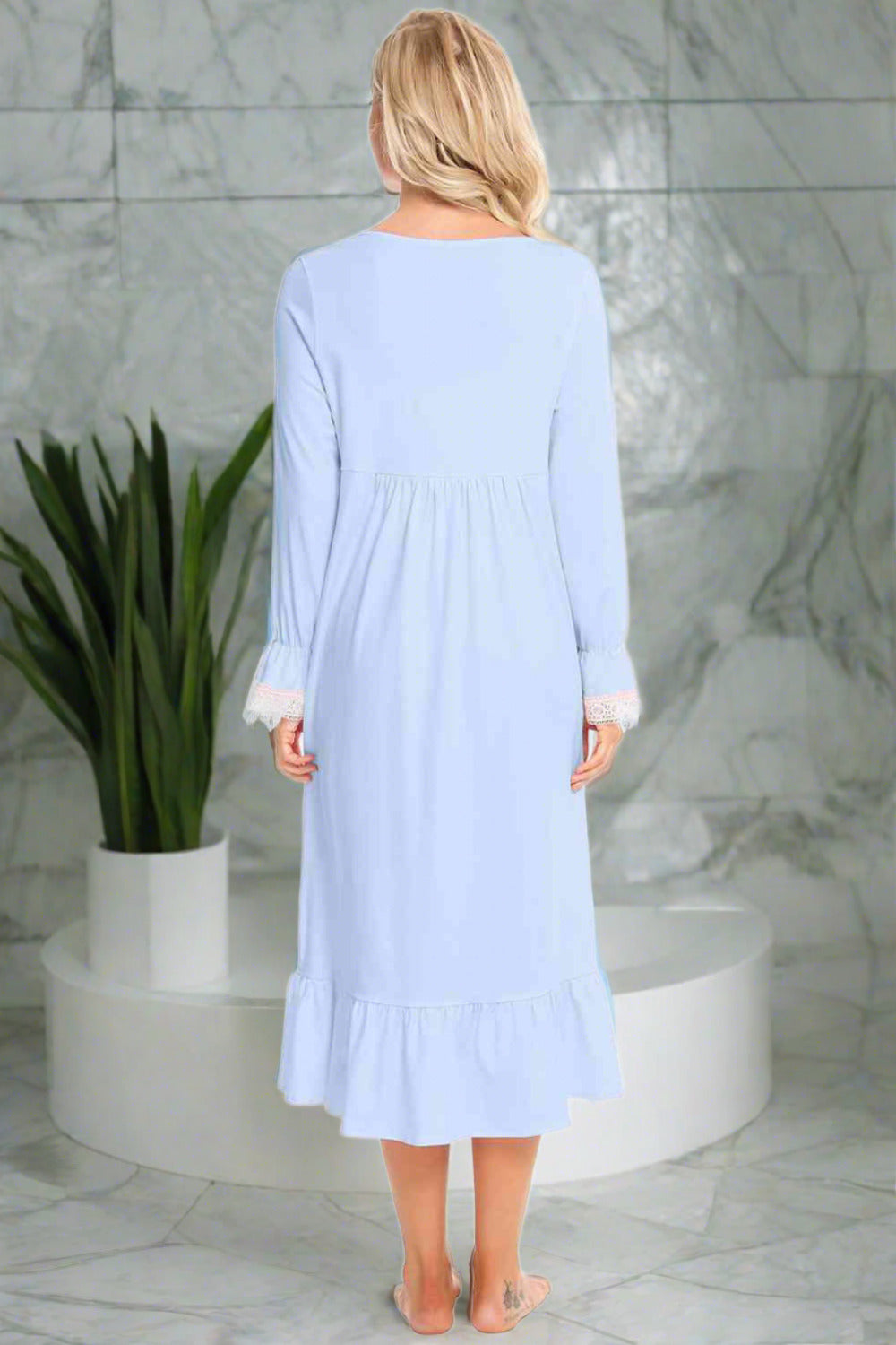Back of Model wearing traditional long sleeve blue nightgown