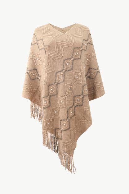 Beige poncho with faux pearl and fringe trim
