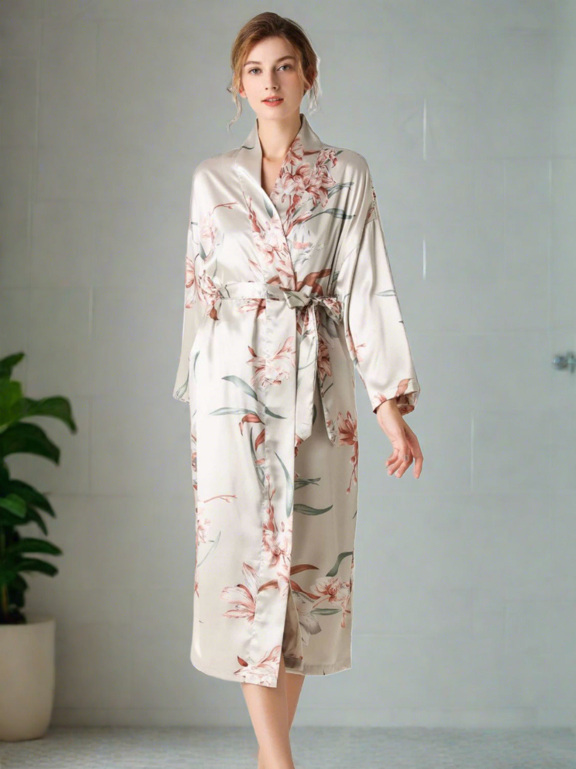Model walking wearing light gray floral patterned robe