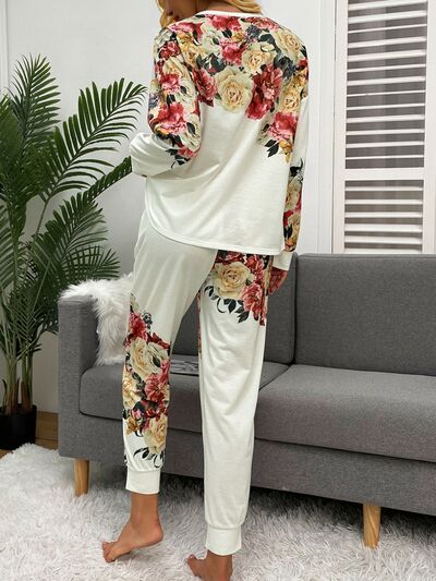 Back of model wearing white pajama set with flower print
