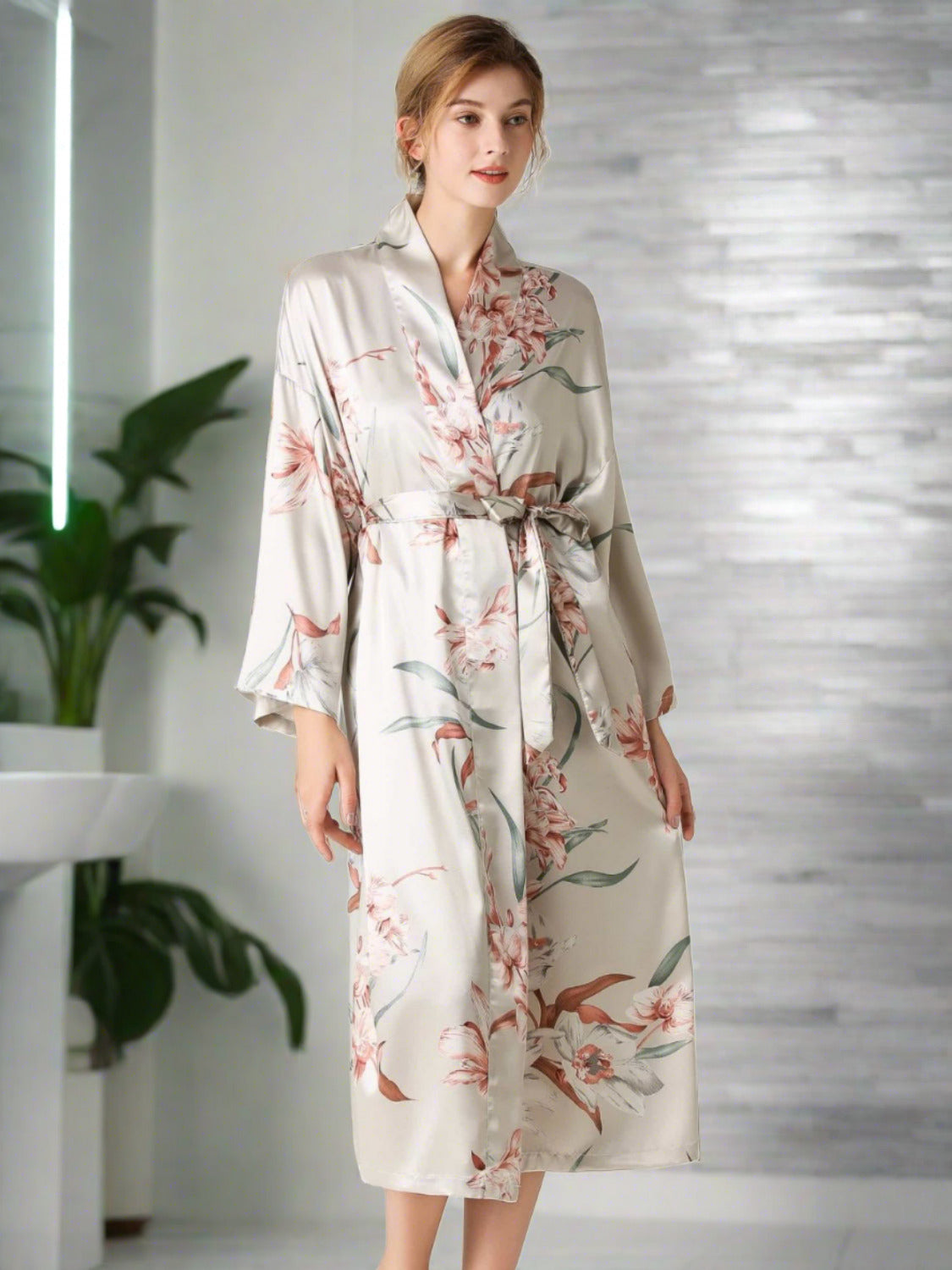 Model wearing light gray floral patterned robe