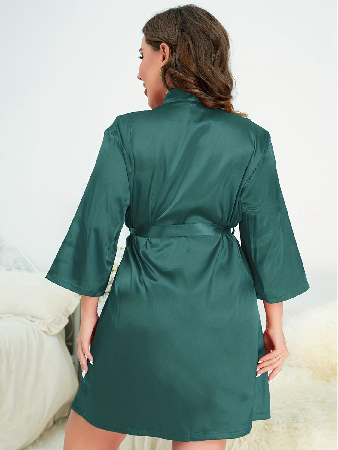 Back of model wearing green plus size robe