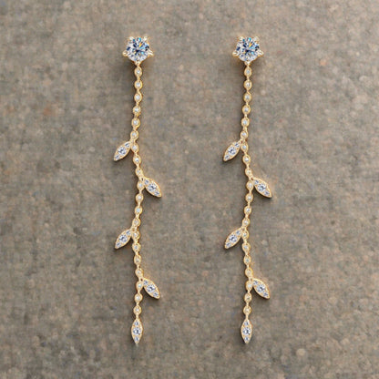 Moissanite drop earrings set in gold plated sterling leaf setting