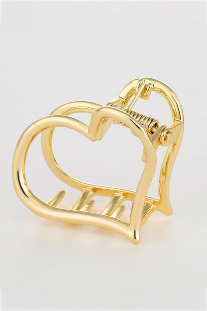 Angle view of gold plated heart-shaped claw clip