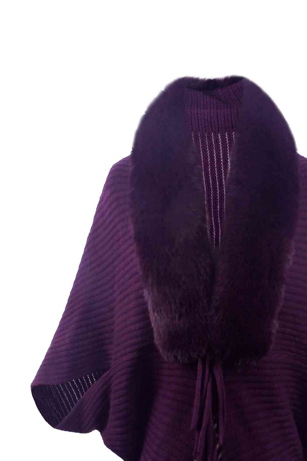 Close up of purple open front poncho with fringe and faux fur trim