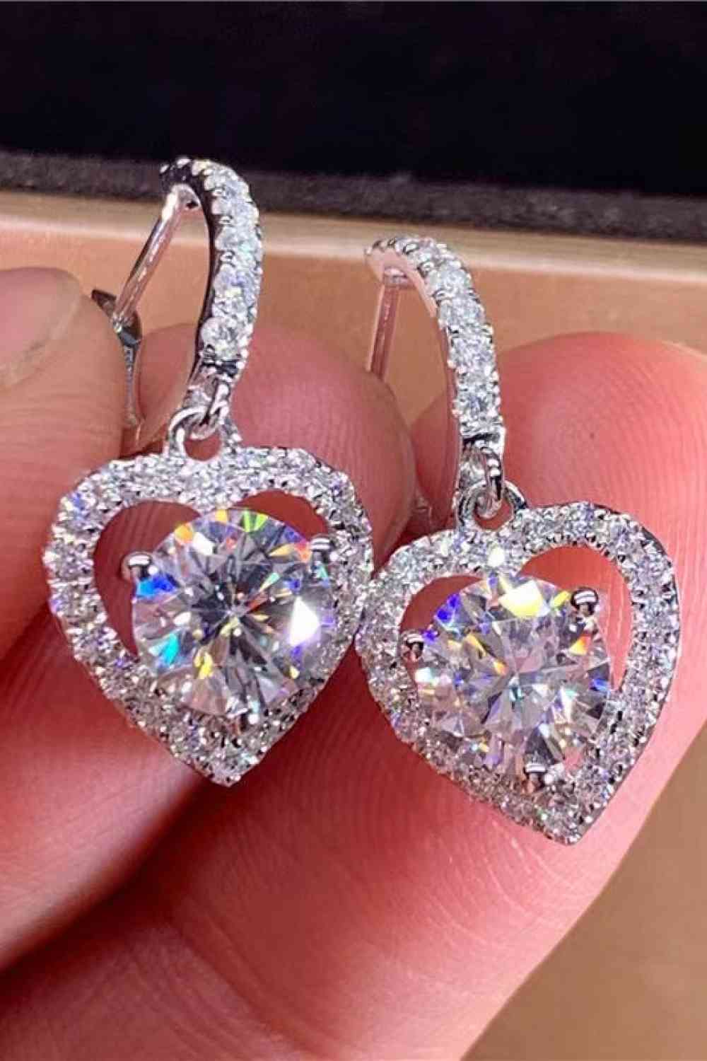 Clear Moissanite heart earrings with zircon accent stones set in platinum plated sterling silver