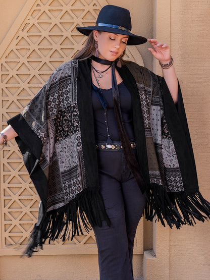 Model wearing black plus size open front poncho cover up
