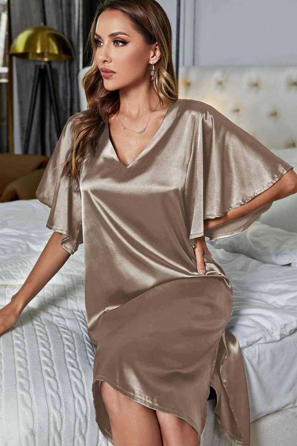 model sitting on bed wearing khaki knee length nightgown