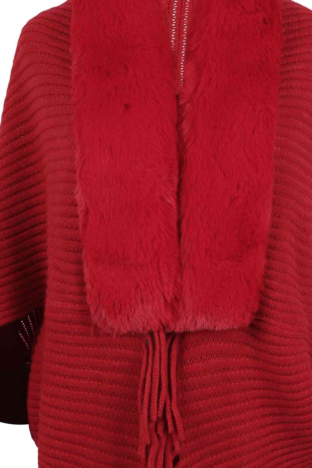 Close up of faux fur trim on red open front poncho