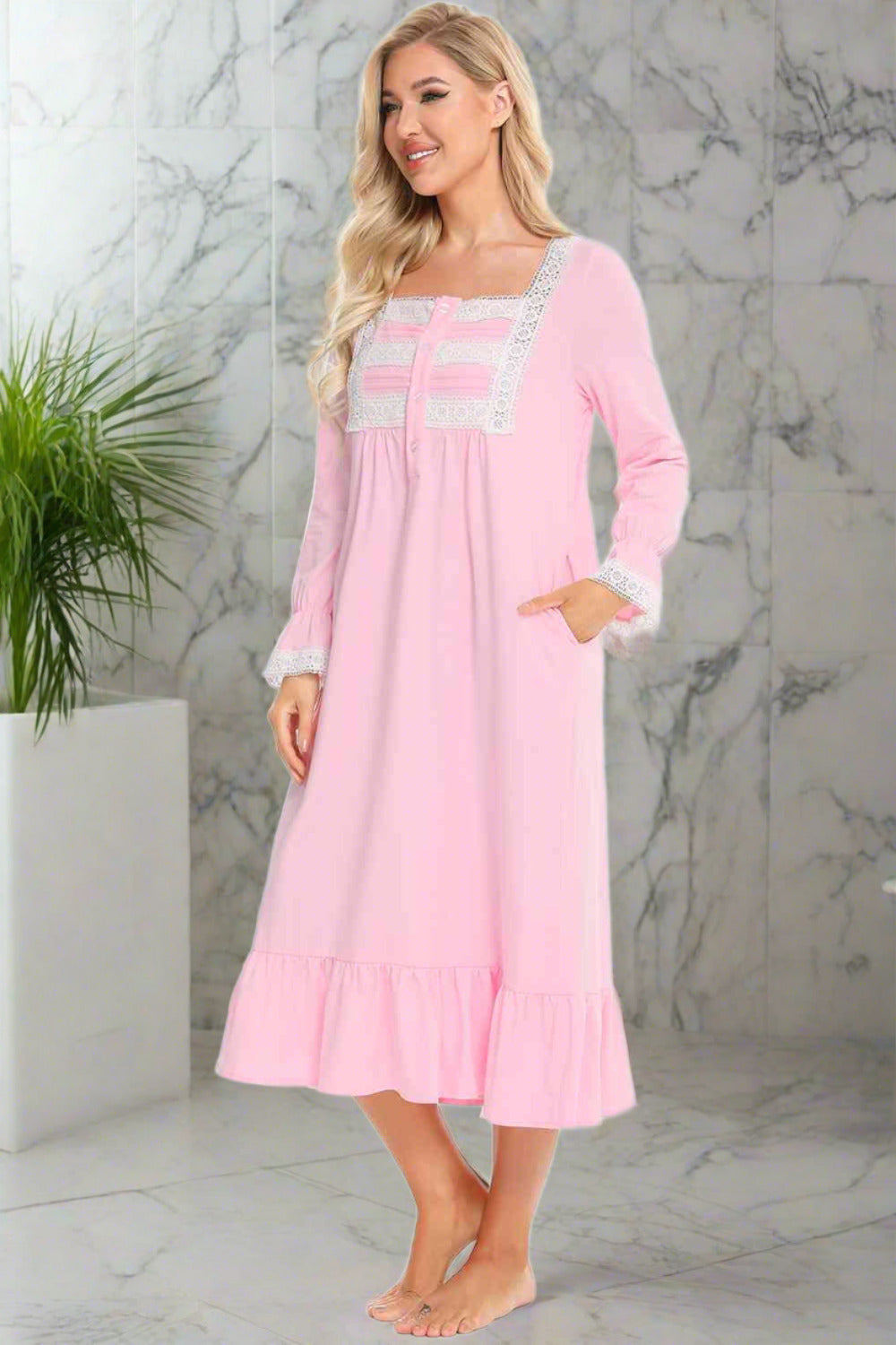 Model wearing traditional long sleeve pink nightgown