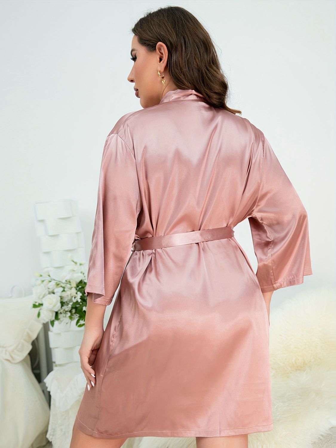 Back of model wearing pink plus size robe