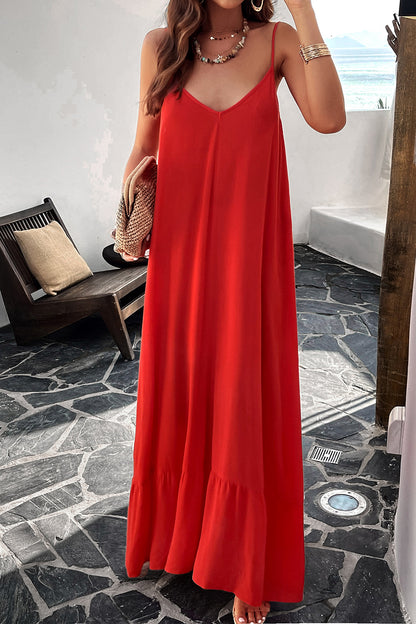 Model standing outside wearing red spaghetti strap loungedress