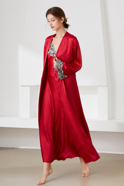 Woman walking wearing red satin nightdress and matching robe with lace trim