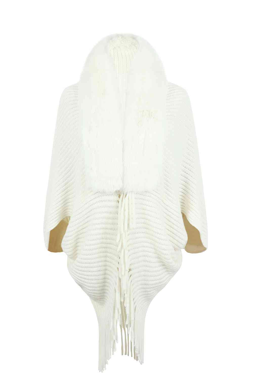 Photo of ivory open front poncho with fringe and faux fur trim