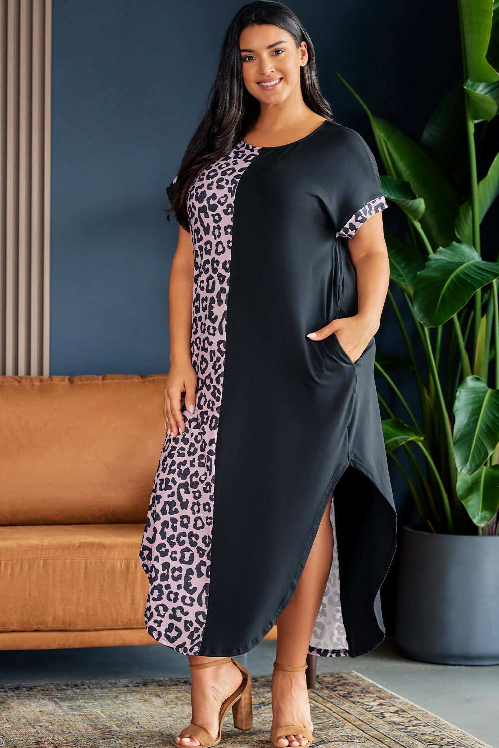 Model wearing plus size short sleeve blacka and leopard lounge dress