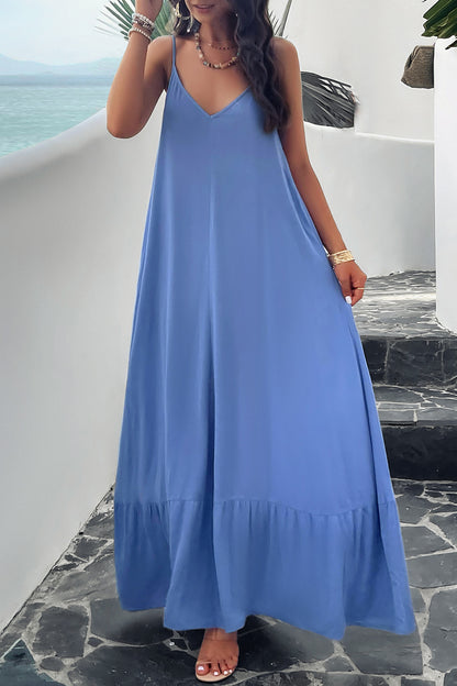 Model standing outside wearing blue spaghetti strap loungedress